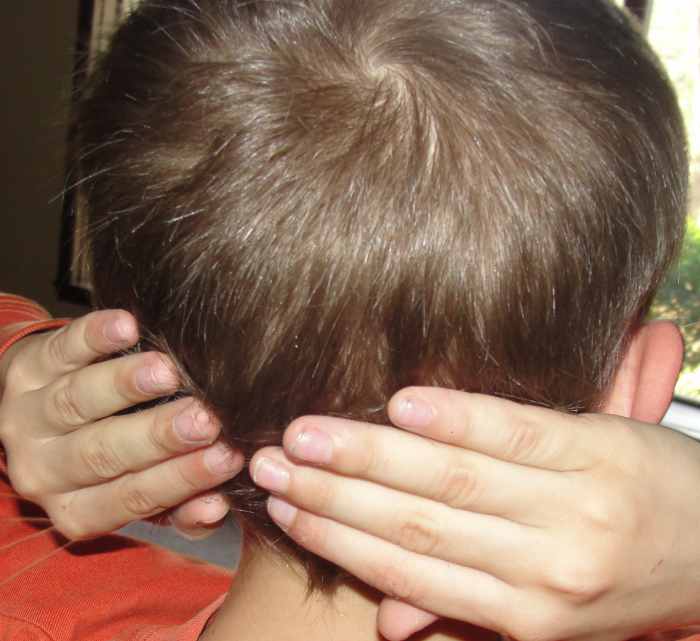 Touching his occipital lobes