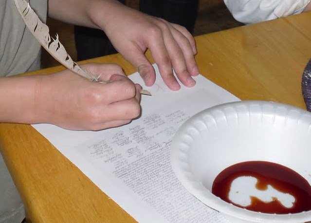 Signing the Declaration of Independence using quill pens and homemade pecan shell ink