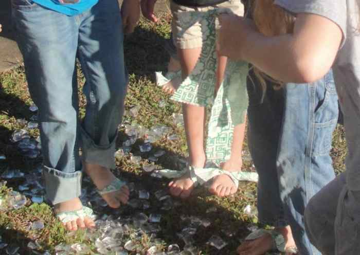 Walking on ice in the cold without jackets and without shoes