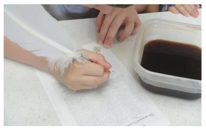 Singing the Declaration of Independence using a quill pen and homemade ink from Lesson 3: Lexington and Concord, Thomas Jefferson, and Declaration of Independence Lesson
