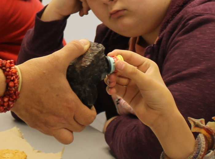 Testing rocks to see if they're magnetic