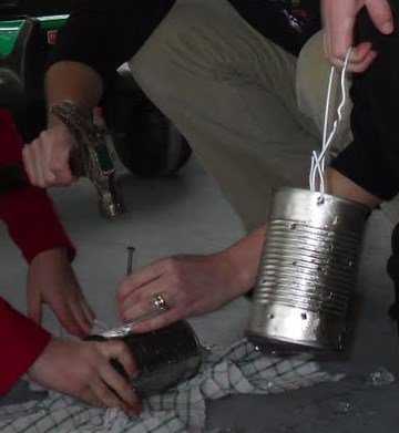 Making tin can lanterns