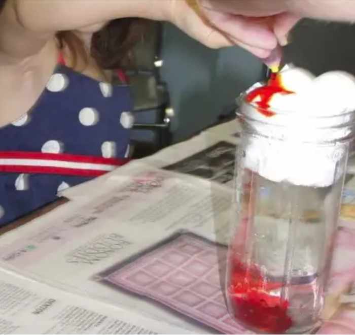 Food dye raining through a cloud of shaving cream