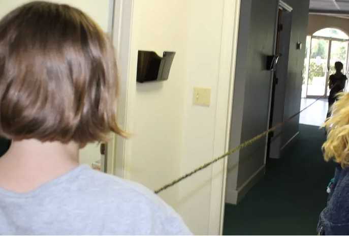 Holding a 20 foot rope to show the length of the small intestine