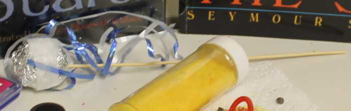 This gives you a side view of the aluminum foil ball comet model so you can see the stick