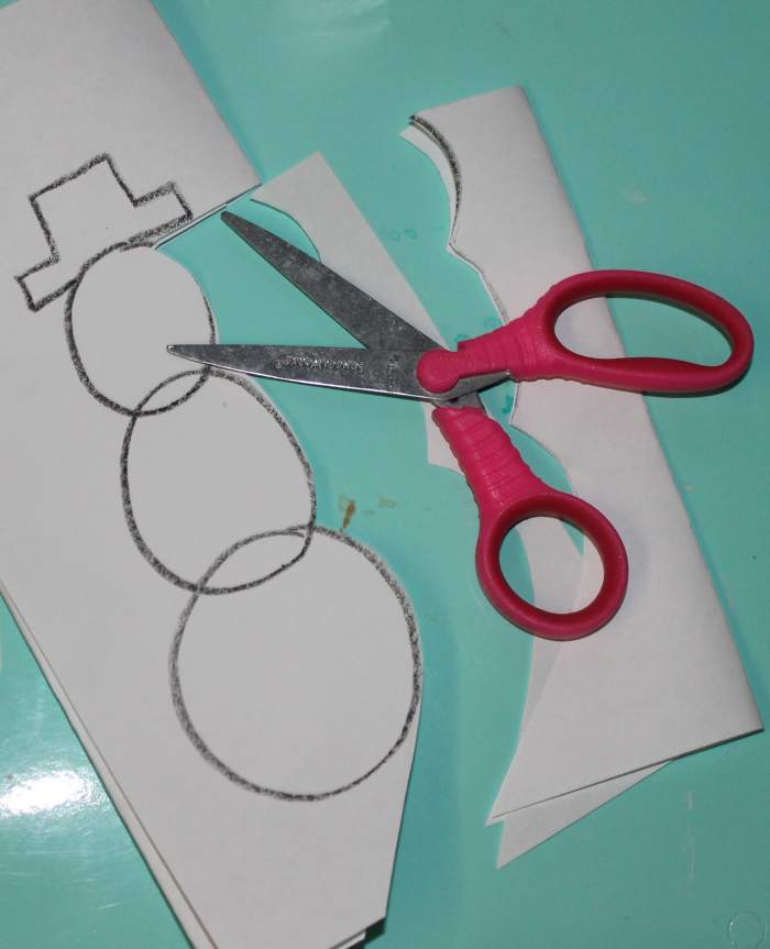 Cutting out the snowmen