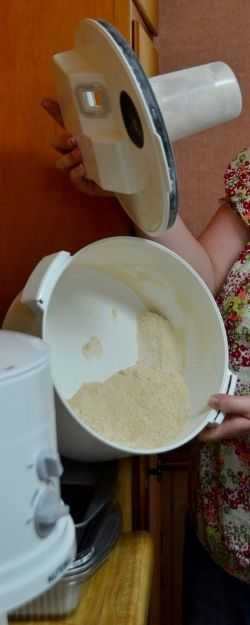 Grinding wheat into flour - Photo credit: Michelle Harrison, who attends our class 