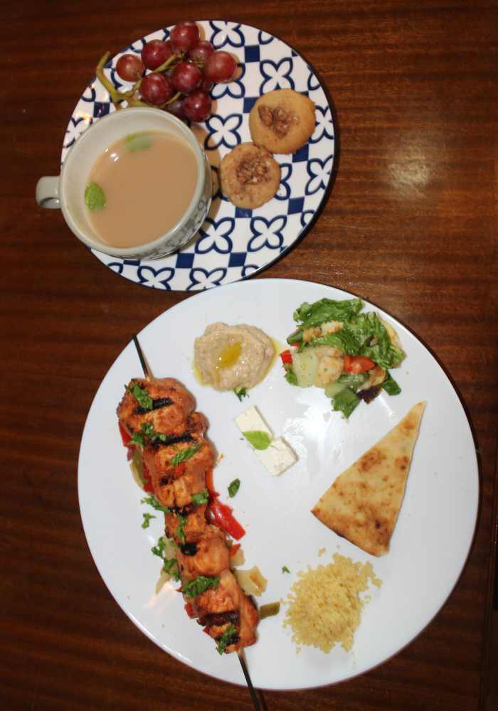 The second time we made this meal we added feta cheese, grapes, and couscous. The fattoush, hummus, pita, & feta should have been served on a separate plate, but I don't like washing extra dishes. :) 