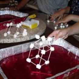 Designing and testing marshmallow and toothpick buildings to test them for earthquake sustainability from Lesson 5: Earthquakes