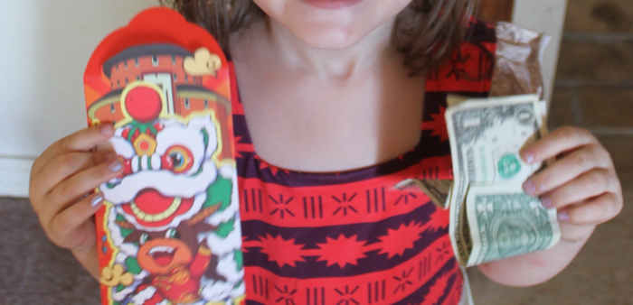 Receiving a red envelopes with money inside