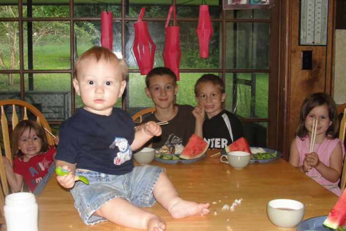 Enjoying our Chinese meal complete with chopsticks and red paper lanterns