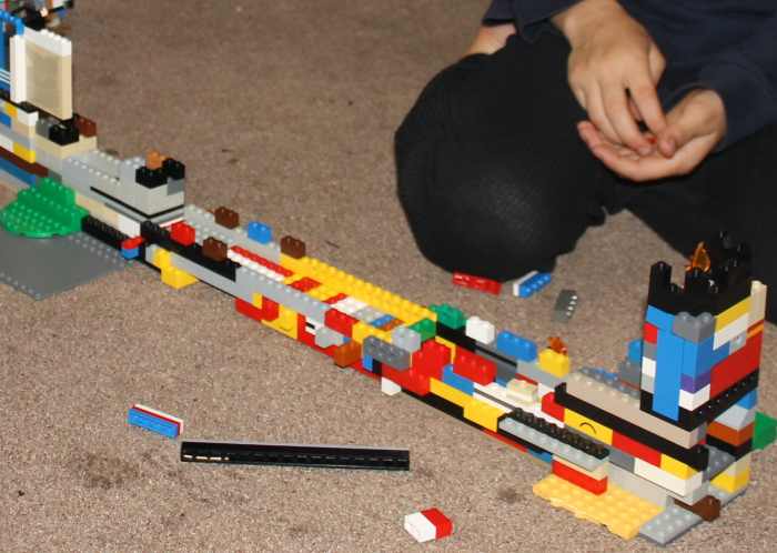 Working together to combine the individual Lego walls to become the Great Wall of China