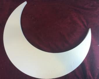 Taping a moon shape to a child's shirt to demonstrate the relationship between the moon and tides. Image credit: https://www.etsy.com/search/handmade/craft-supplies-and-tools?q=crescent+moon