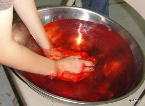 Washing hands in "Brazen Laver" (We used red food dye for blood, but I'd recommend using ketchup because it wouldn't stain hands as much.)