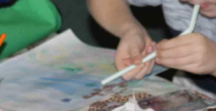 Blowing the paint to make tree trunks and branches