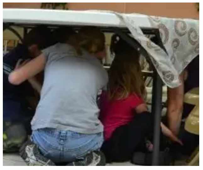 Cramming together in the "steerage" while dramatizing arriving at Ellis Island 