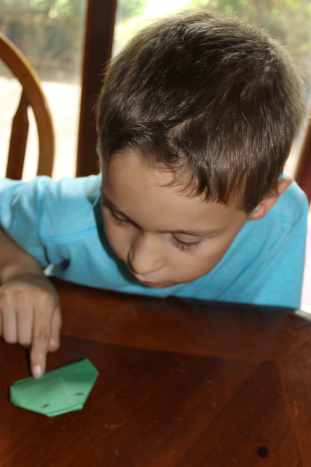 You can also make the origami frog using green copy paper (what can be used in printers).  We learned the hard way that using construction paper makes a "lethargic" frog that does not jump as well.