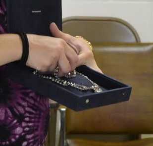 Showing off the "crown jewels" (really costume jewelry) while talking about the royal jewels