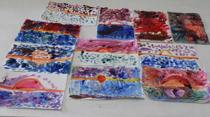 Early elementary dab painting inspired by Claude Monet's "Impression - Sunrise"