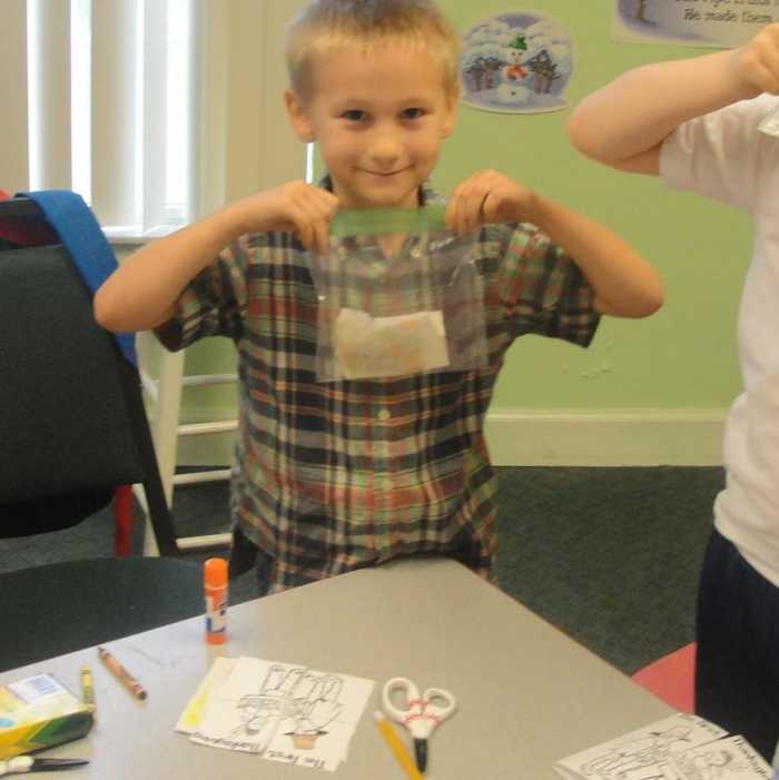 "Planting" corn in a wet paper towel in a bag