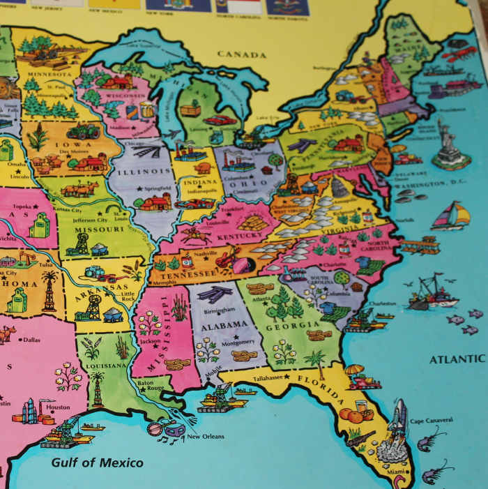 Pointing out the 13 Original Colonies on the US map from the book atlas, "It's a Big, Big World."