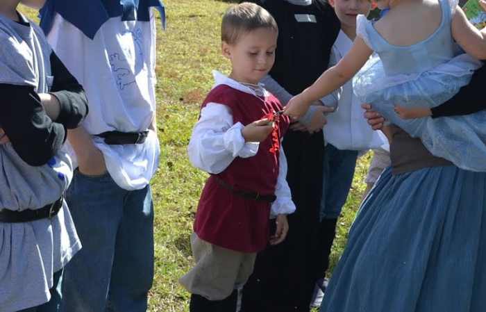My "Lady in Waiting" daughter giving my "squire" son her lady favor before the jousting begins