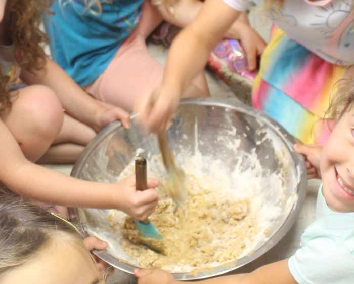 Mixing together the ingredients to make peanut butter cookies
