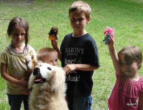 Waiting outside the door to our back patio with favorite stuffed animal ("lamb") to sacrifice - The screen around our back patio was our pillars and white curtains. = the Outer Court. A towel over the back patio door = Door to Outer Court 
