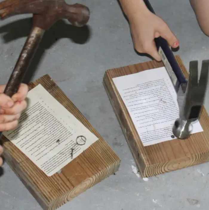 Nailing copies of the "Ninety-five Theses" was one of the activities we did this week during our History Morning Basket & Activities time on the Protestant Reformation.