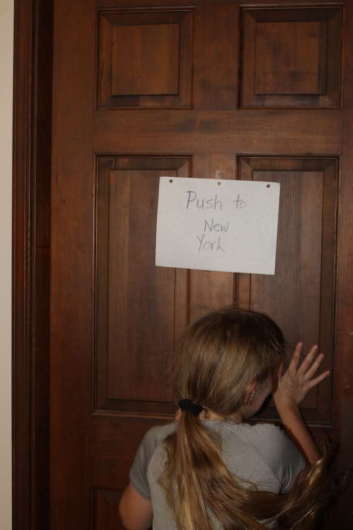 Dramatizing an immigrant pushing the door to enter America 