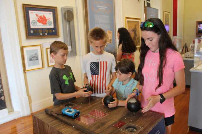 Comparing cannon ball weights at the Cabildo