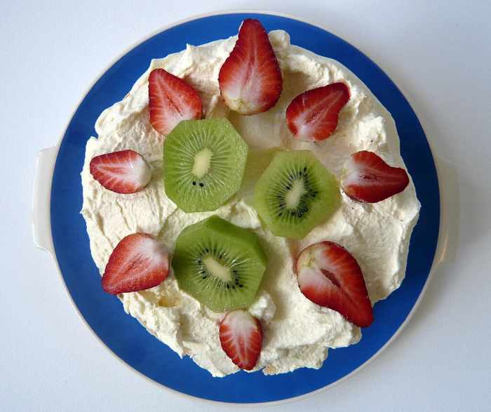 Pavlova (Meringue topped with whipped cream and fruit)