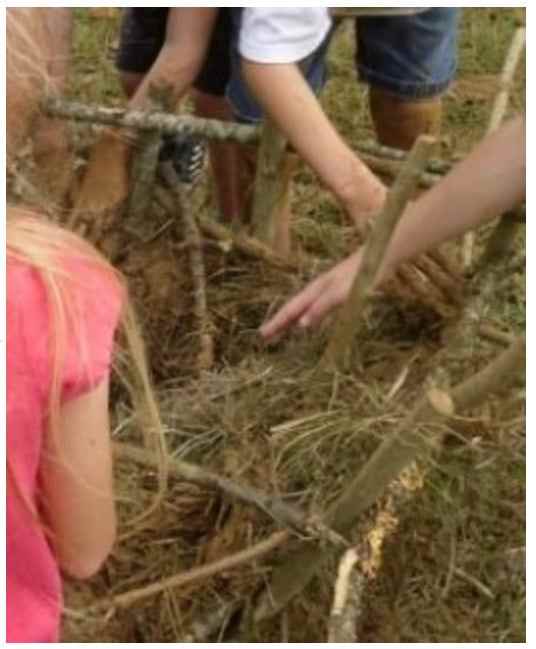 Building a Jamestown-style waddle and daub house during Lesson 1: Jamestown Lesson