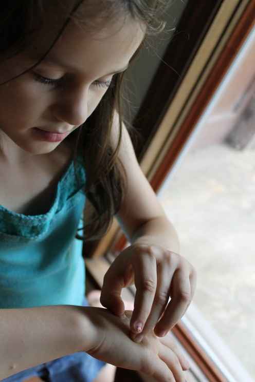 Shedding "skin" (dried Elmer's glue) like a reptile, which is one of the activities we this week as described in: Science Morning Basket & Activities: Fish, Amphibians, & Reptiles.