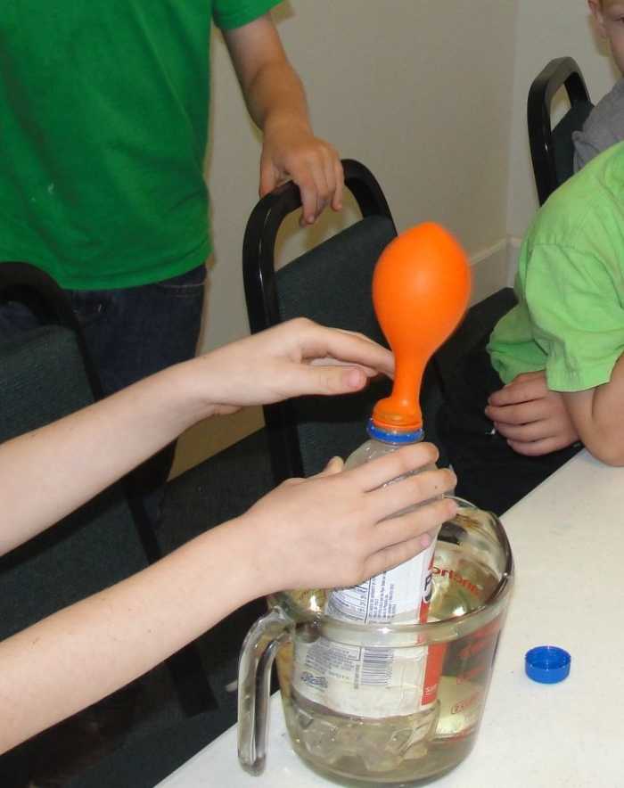 Watching steam fill a balloon just like how steam helped move Robert Fulton's steamboat