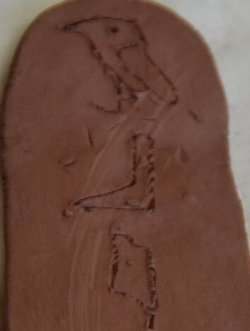 Children carved their names in hieroglyphics in clay to make cartouches.