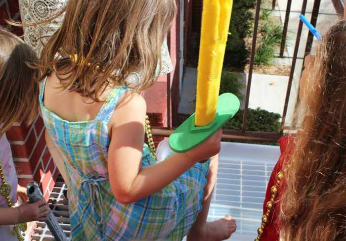 Setting foot in the "Pacific Ocean" (either a bathtub, container of water, or water fountain)