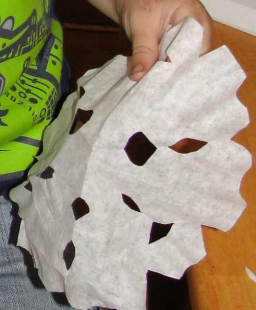 Cutting out paper snowflakes was one of the activities we did this week at home during our History Morning Basket & Activities time from the above link on the Exploration of Canada.