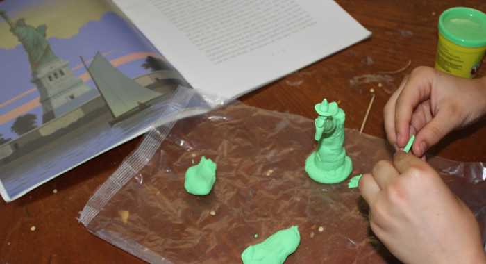 Creating a model of the Statue of Liberty using green Play-doh