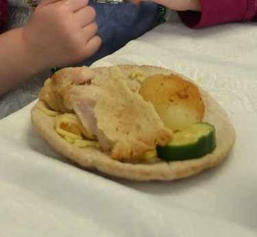 Trencher (pita bread plate) with the meal