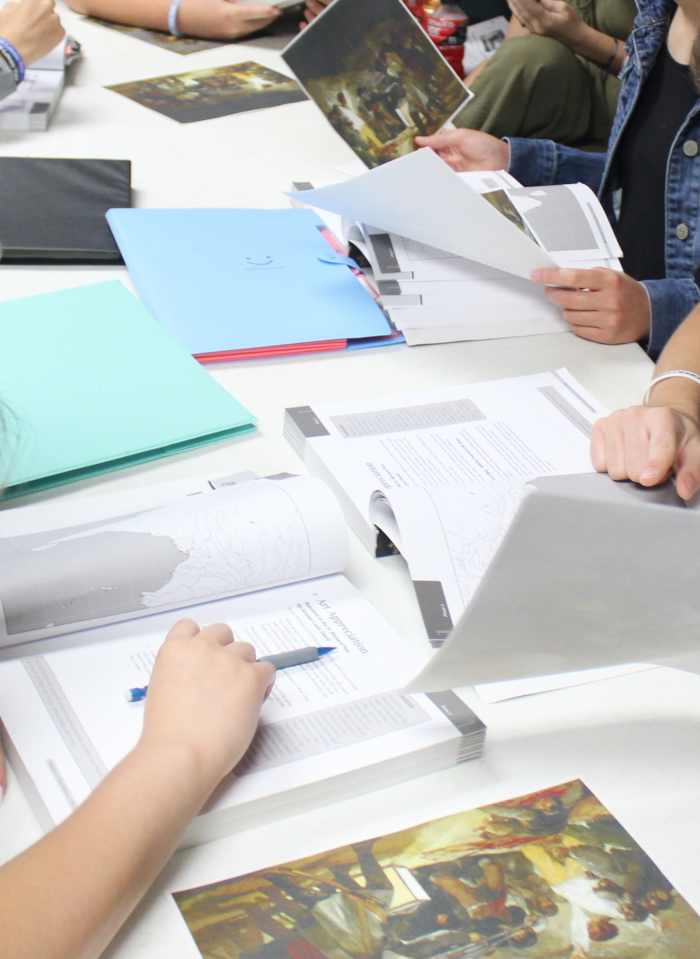 Students studying and comparing portrayals of Napoleon in art