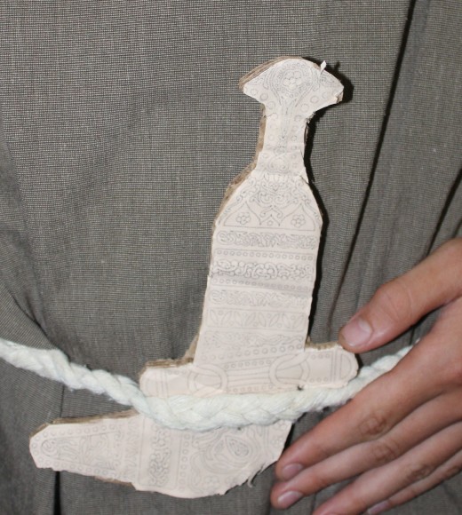 Khanjar made from cutting out the shape on cardboard and pasting an image on the front - We got this image from https://tse2.mm.bing.net/th/id/OIP.5xpCi8ulbUatpovoIy1MSgHaE9?pid=Api&P=0&h=220 