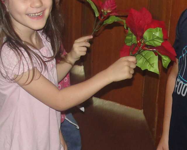 Girls pretending to be bees "stinging" the boys