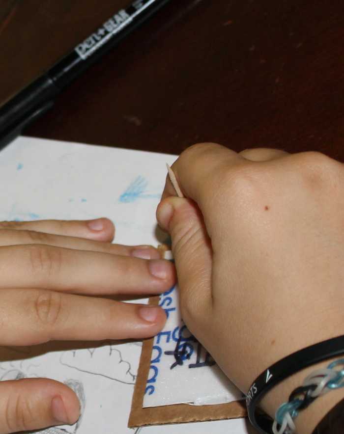 We created the woodblock prints using Styrofoam glued to cardboard. After using a Sharpie marker to draw on the Chinese character or other deign, the children then poked or carved the design out using a toothpick.