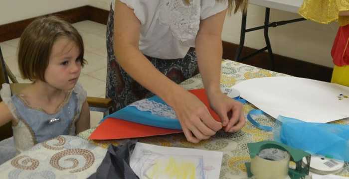 Younger children will need help cutting and stapling their hat but will enjoy decorating it themselves.