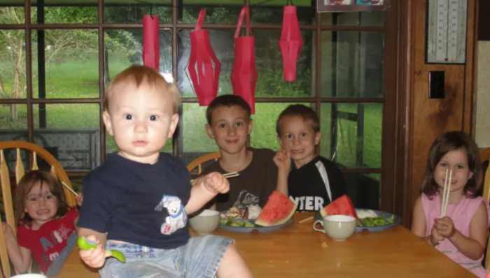 Enjoying our Chinese meal complete with chopsticks and red paper lanterns