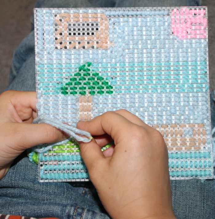 Lower elementary aged child finishing up the simplified "embroidery" project