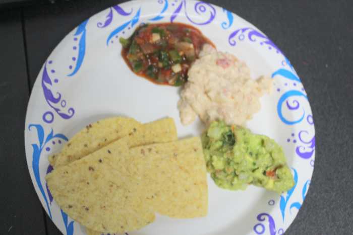 Chile Con Queso along with homemade guacamole & salsa