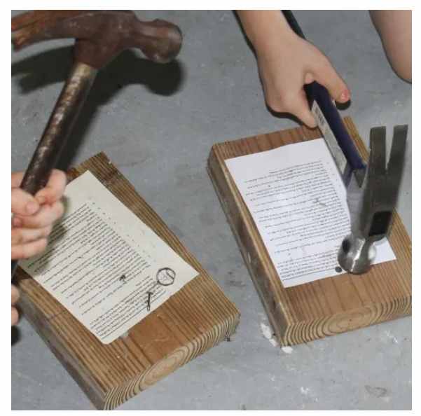 Nailing copies of the 95 Theses to the Wittenberg Door