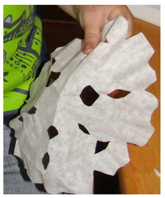 Cutting out coffee filter (or paper) snowflakes